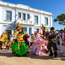 Colorfully dressed Colombians dance