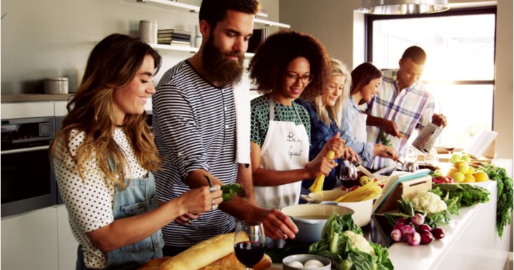 Young people cook together. 